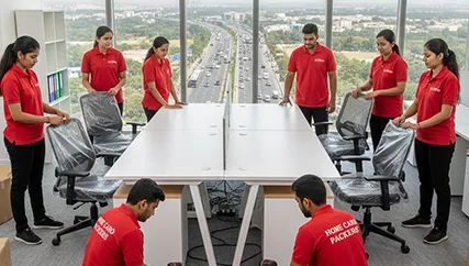 Office movers unpacking office furniture and equipment in Ahmedabad for a corporate relocation