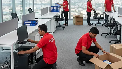 Office movers unpacking and setting up office desks in Bopal
