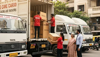 Movers unloading large furniture and boxes during household relocation in Chanakyapuri, Ahmedabad
