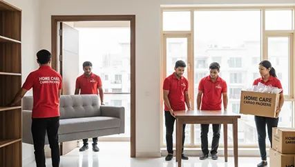 Movers unloading large furniture and boxes during household relocation in Geratpur, Ahmedabad
