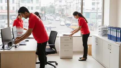 Movers unpacking office desks and setting up the workspace in Geratpur, Ahmedabad