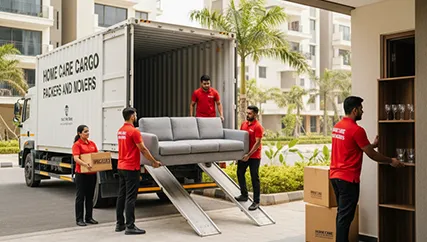 Movers unloading packed boxes and furniture from the truck