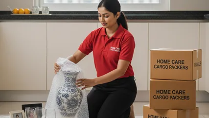 Movers Packing Household Items Carefully