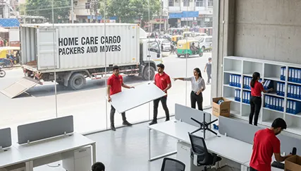 Efficient Office Relocation – Movers Organizing Office Equipment