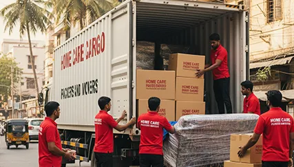 Experienced packers and movers loading goods onto a moving truck