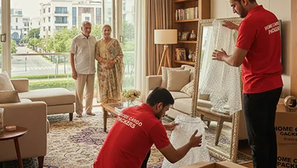 Movers wrapping fragile items for safe relocation in DLF Phase 1, Gurugram