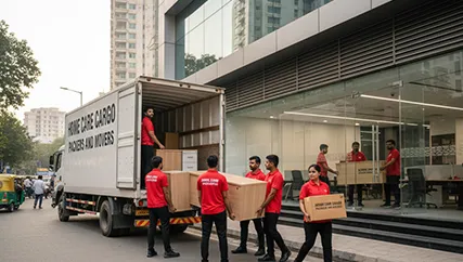 Movers unloading office furniture in DLF Phase 4, Gurugram