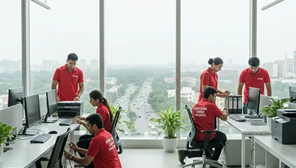 Packers organizing office equipment in Golf Course Road, Gurugram