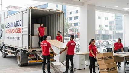 Packers unloading office furniture in Manesar, Gurugram