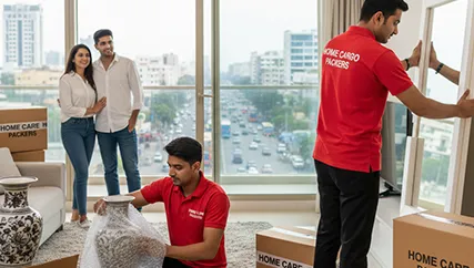 Movers carefully wrapping fragile items in MG Road, Gurugram