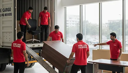 Movers unloading furniture in an office space