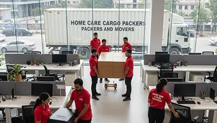 Movers unloading office furniture in Roshan Pura, Gurugram