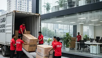 Movers unloading packed office furniture in Sector 12A, Gurugram