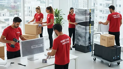 Office relocation team packing office equipment
