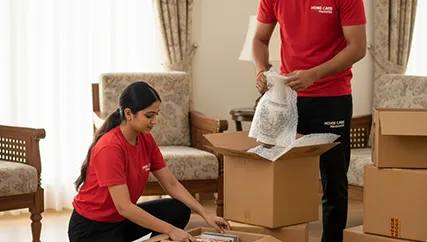 Movers packing household items