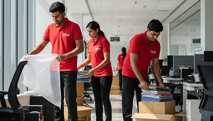 Office relocation team packing office assets