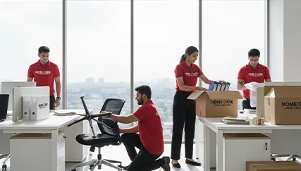 Office relocation with movers carefully transporting furniture and electronics