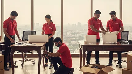 Office movers disassembling office desks and packing electronics in Sohna, Gurugram