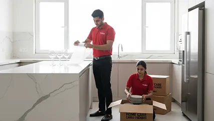 Movers packing fragile items and kitchenware in Sohna Sector 11, Gurugram