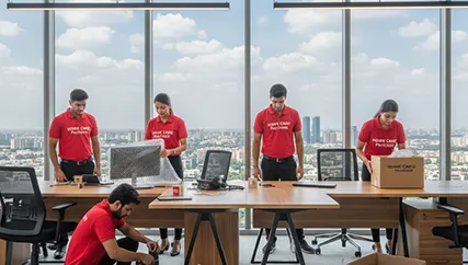 Office movers disassembling furniture and packing electronics in Sohna Sector 14, Gurugram