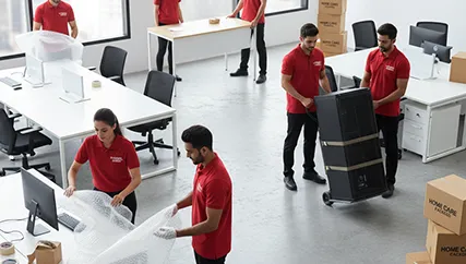 Office relocation staff transferring office equipment professionally